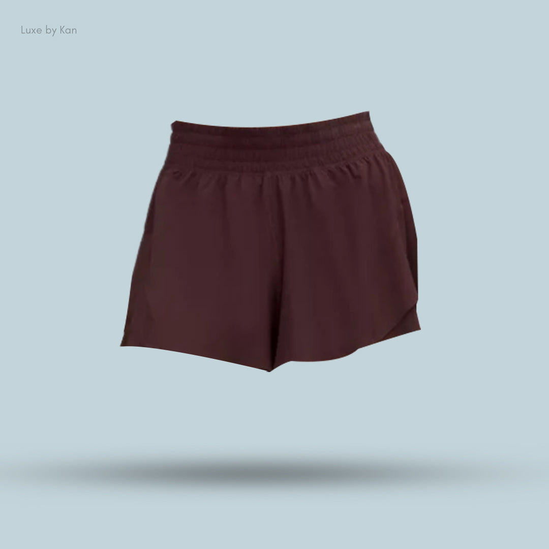 Maroon Lululemon Shake It Out High-Rise Running Shorts 2.5", featuring a comfortable elastic waistband.