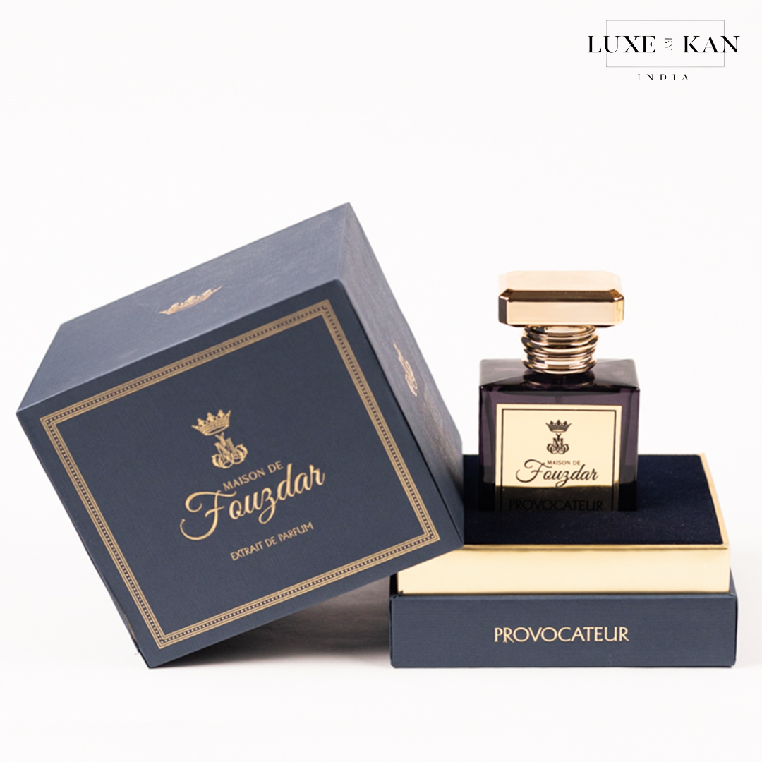 A luxurious perfume bottle by Maison de Fauzdar, elegantly displayed with its navy blue box and gold accents, labeled "Provocateur."