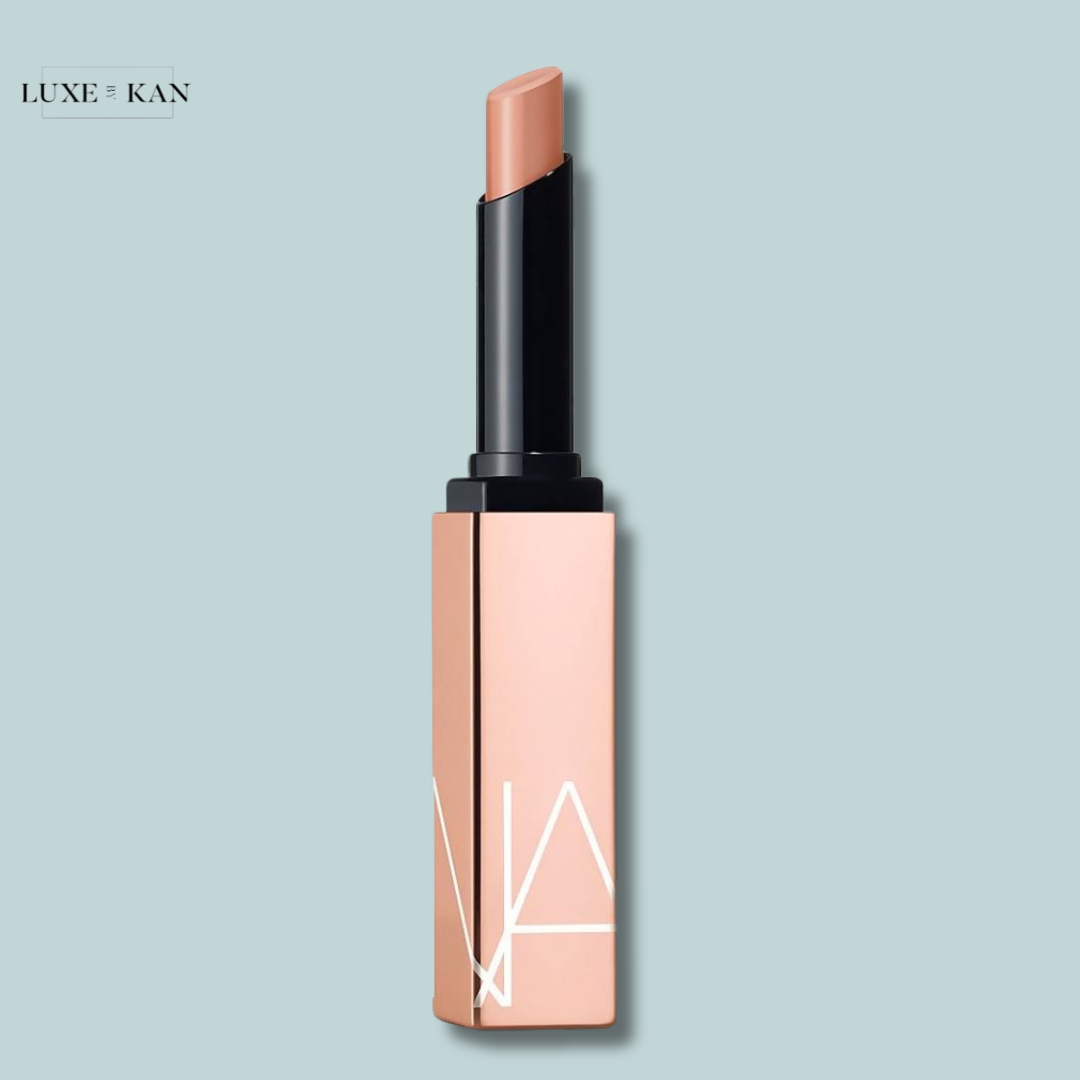 NARS afterglow lipstick in a sleek, modern case with a black top and subtle geometric design.