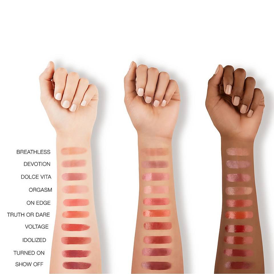 Three hands showcase various nars afterglow lipstick shades with swatches on their arms, highlighting diverse color options.