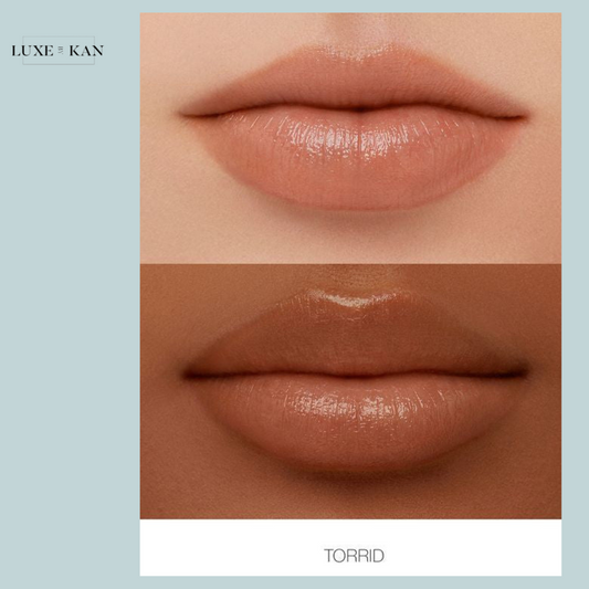 Close-up of two lips showcasing the "Torrid" shade from Luxe & Kan, one light and one dark skin tone, highlighting versatility.