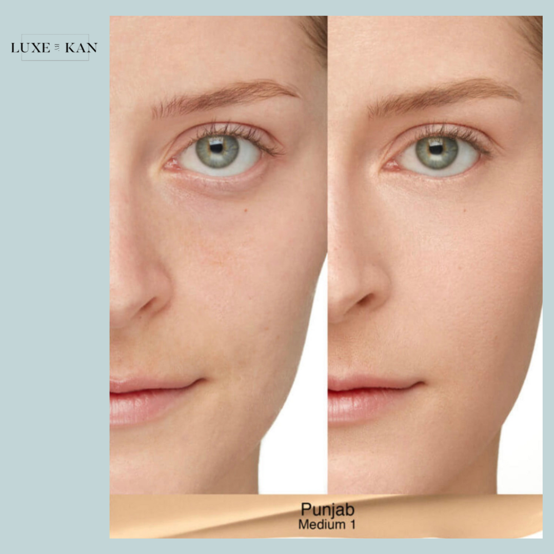 A close-up of a female model’s face showcasing flawless skin with a light, natural look.