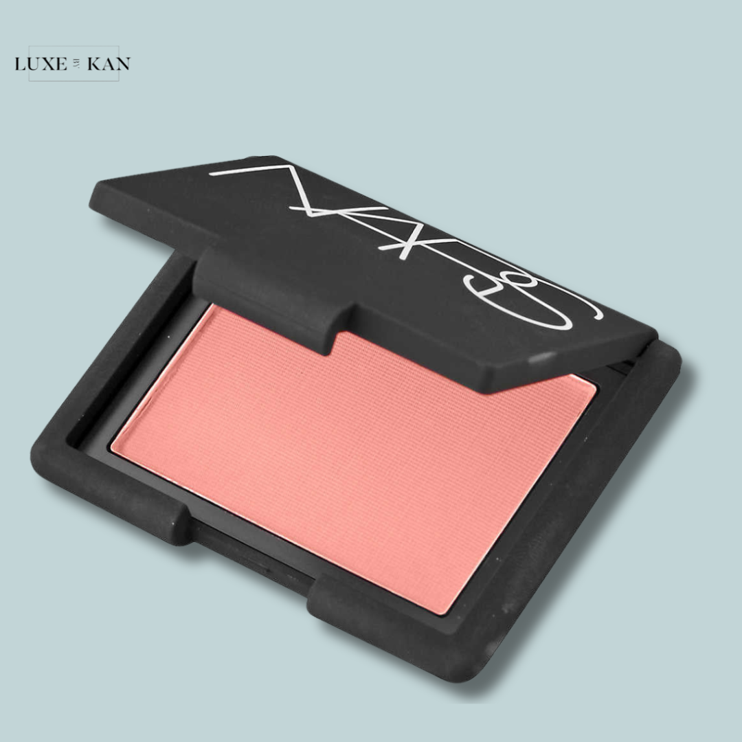 A NARS blush compact featuring a soft pink shade.