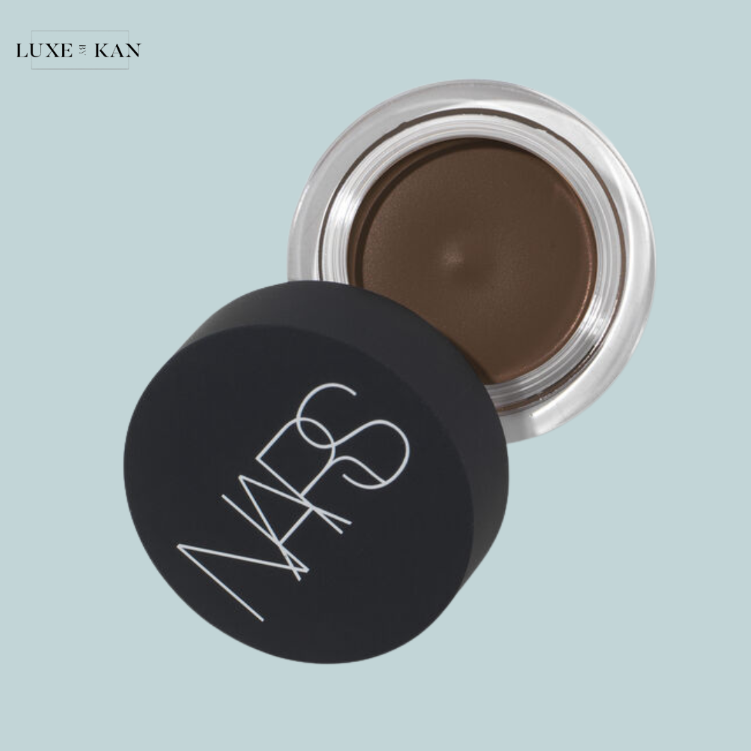 A jar of NARS brow pomade with a dark brown shade.