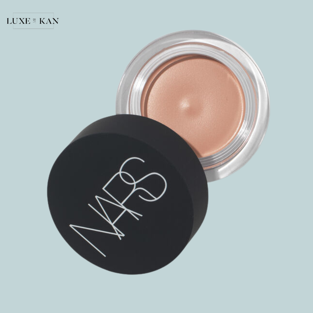 NARS cream pot with a beige hue, slightly opened, showcasing its smooth texture.