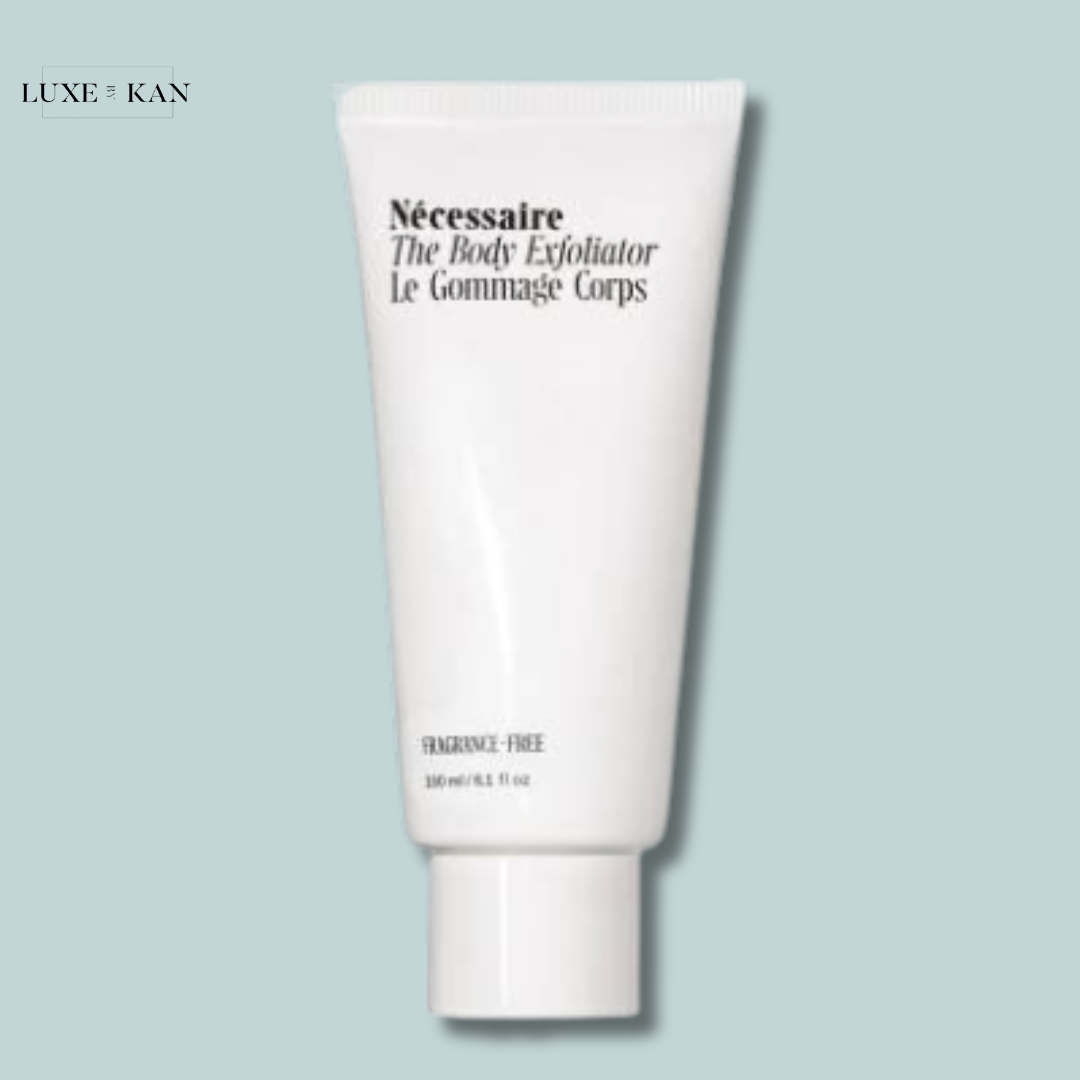 White tube of Nécessaire The Body Exfoliator with a minimalist design, labeled "Fragrance-Free".