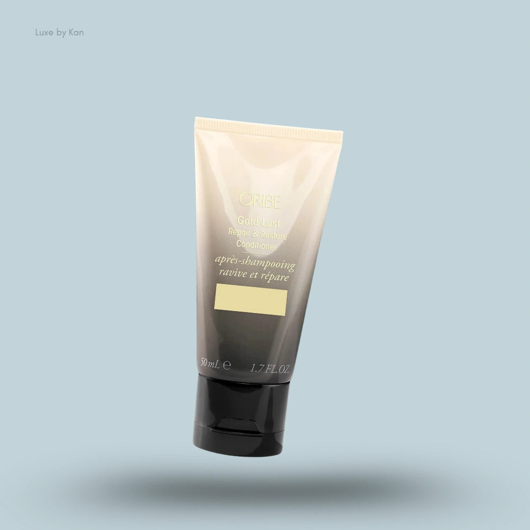 Oribe Gold Lust Repair & Restore Conditioner in a tube with the label "après-shampooing ravive et répare".