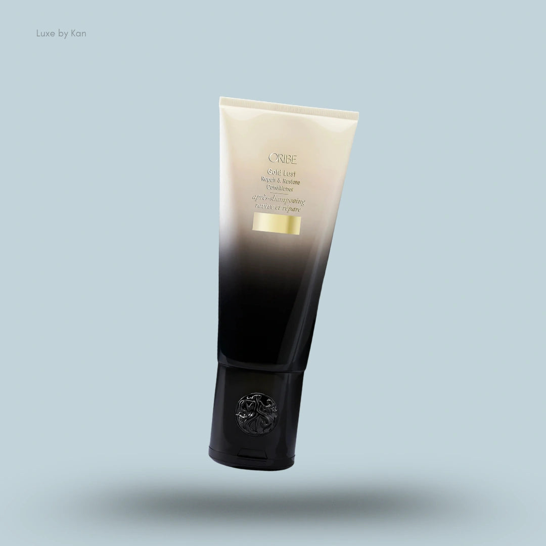 Oribe Gold Lust Repair & Restore Conditioner tube with gradient design.