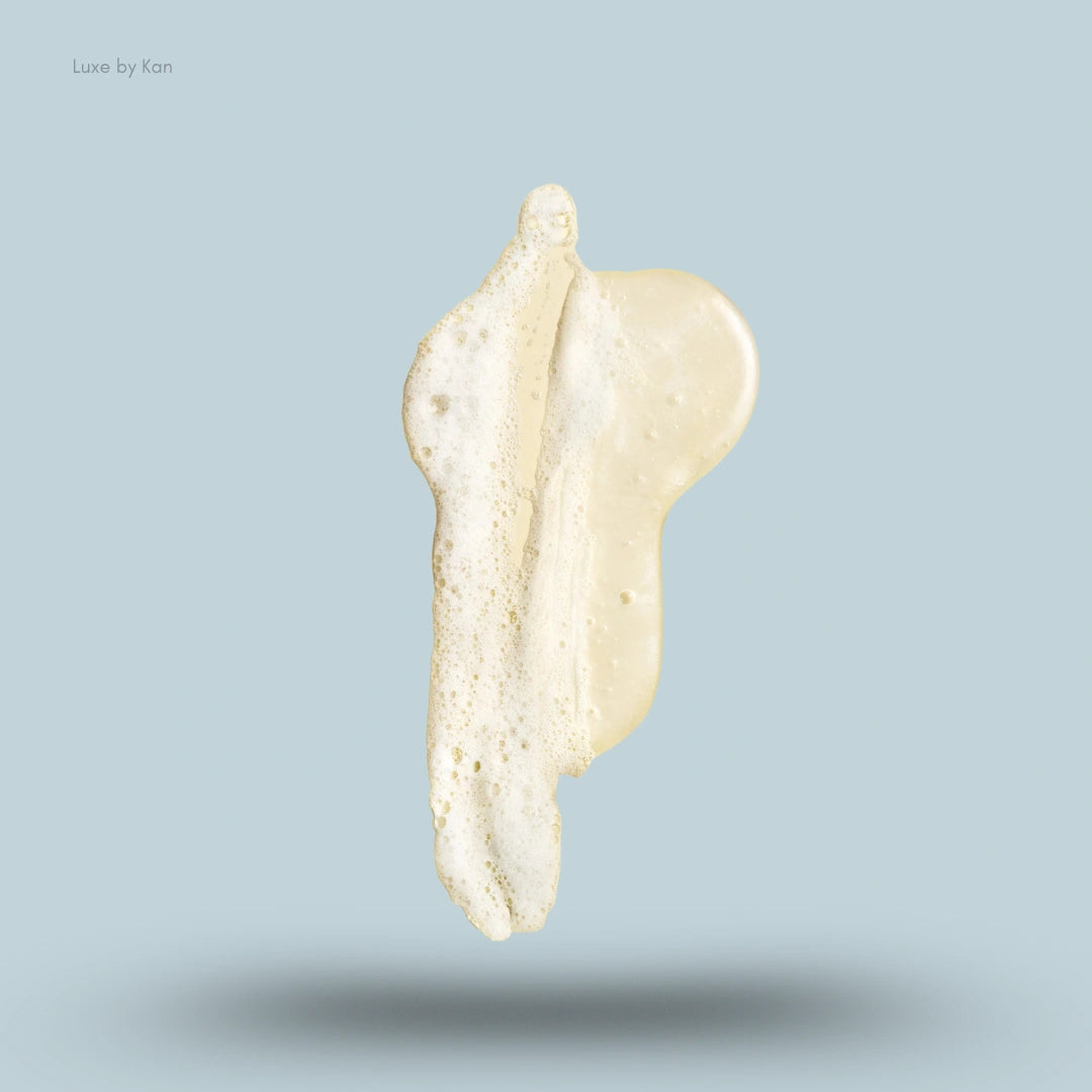 Creamy foam of Oribe gold lust repair restore shampoo.