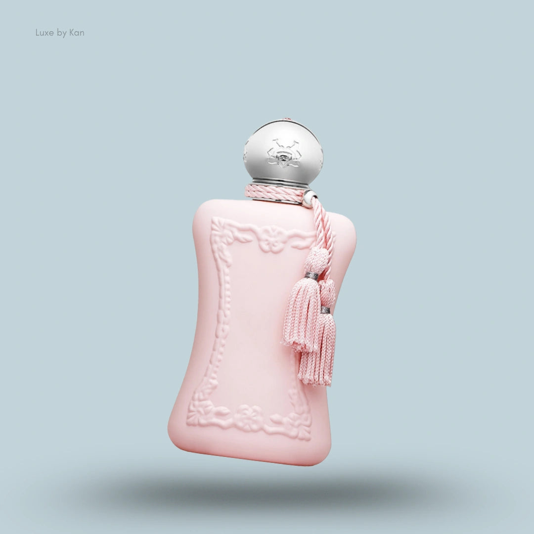 Parfums de Marly Delina bottle, pale pink with silver cap and tassels.