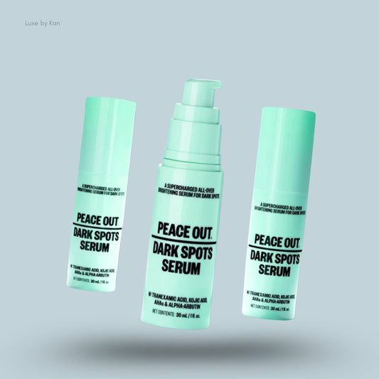Three light-green bottles of Peace Out Dark Spots Serum.
