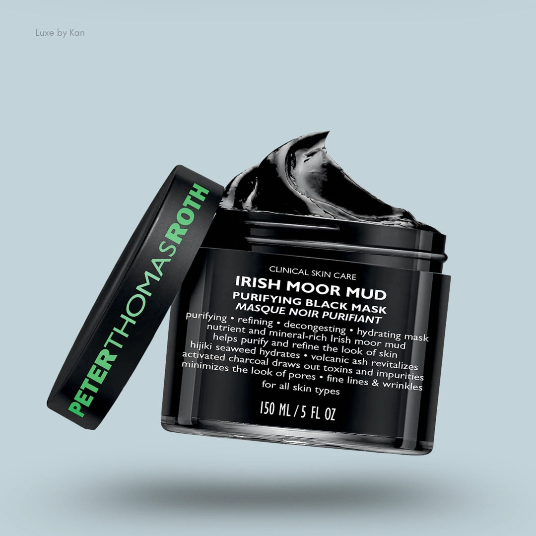 Peter Thomas Roth Irish Moor Mud Purifying Black Mask in a black jar with a dollop of black mud overflowing, with the lid next to the jar.