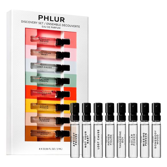 PHLUR Discovery Set featuring eight mini perfume vials, each labeled with unique fragrance names, arranged in a stylish box.