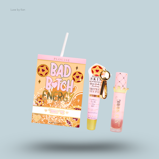 Plouise Bad Bitch Energy lip duo, which includes a juice box themed lip plumper, a lip treatment with keychain, and a lip gloss.
