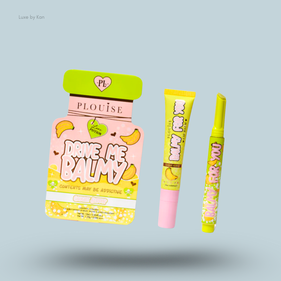 Three colorful beauty products from Plouise: "Drive Me Balmy" lip balm and two lip glosses in vibrant banana-themed packaging.