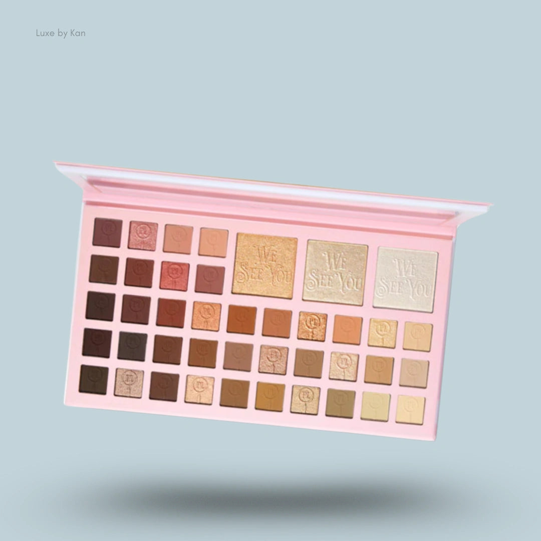 Plouise Eyedentify Your Worth eyeshadow palette featuring 40 eyeshadows in pink packaging.
