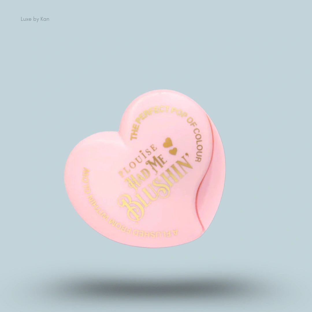 Heart-shaped light pink powdered blush duo packaging labeled “P.Louise Had Me Blushin’.”