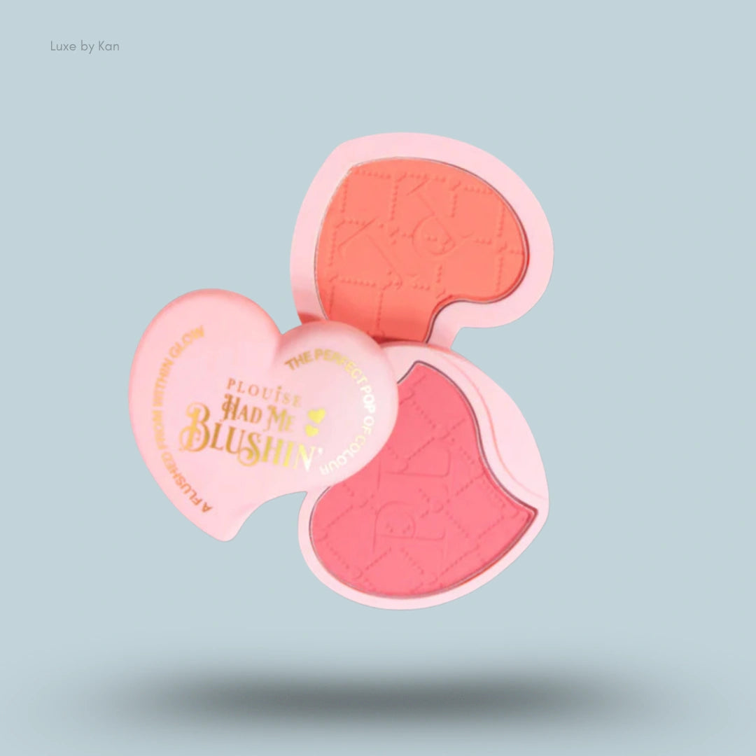 Plouise Had Me Blushin' powdered blush duo in heart-shaped pink compacts, with coral and rose shades displayed.