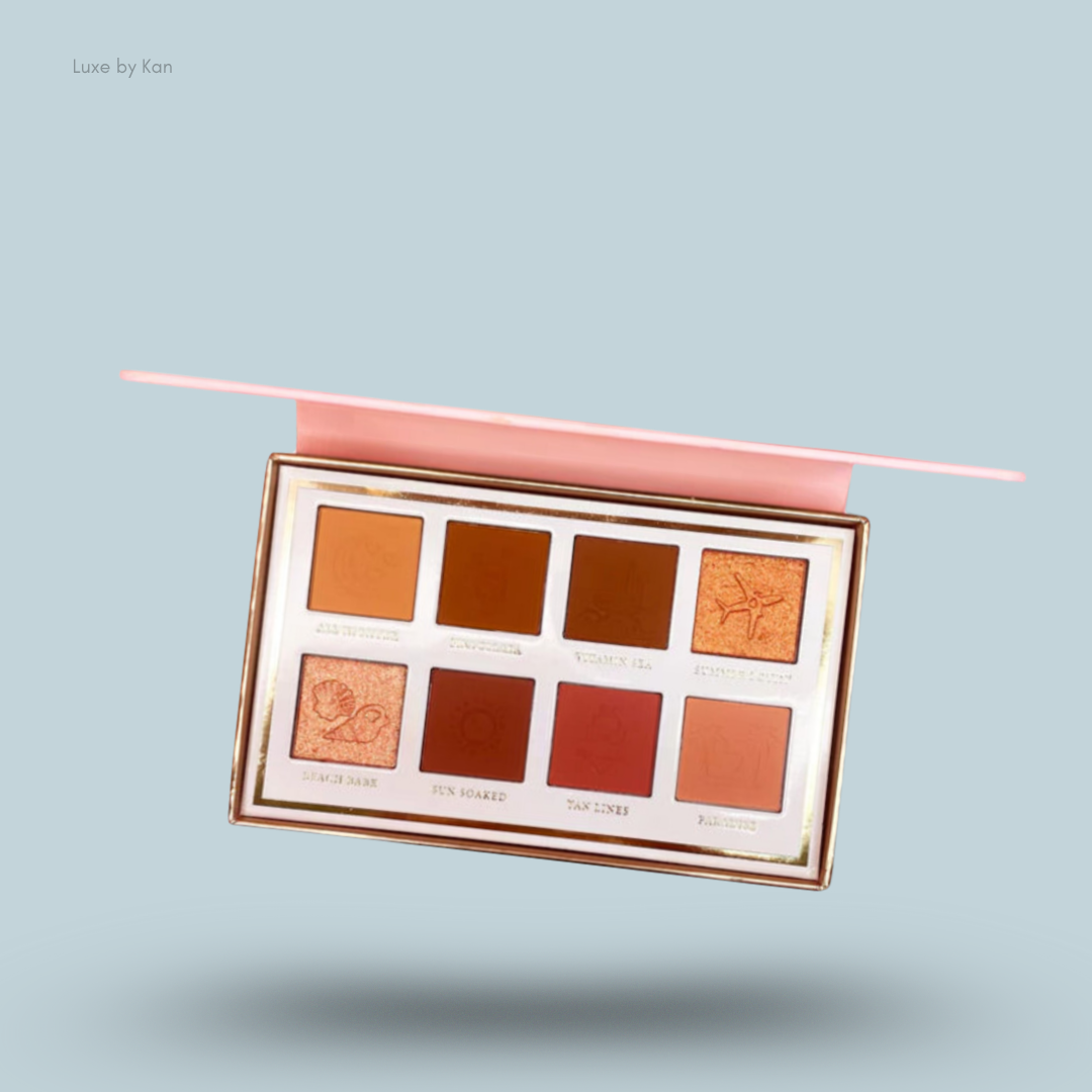 Close-up of the open Plouise Love Tapes palette in "Baecation" with eight shades of eyeshadow in warm, brown, and orange tones.