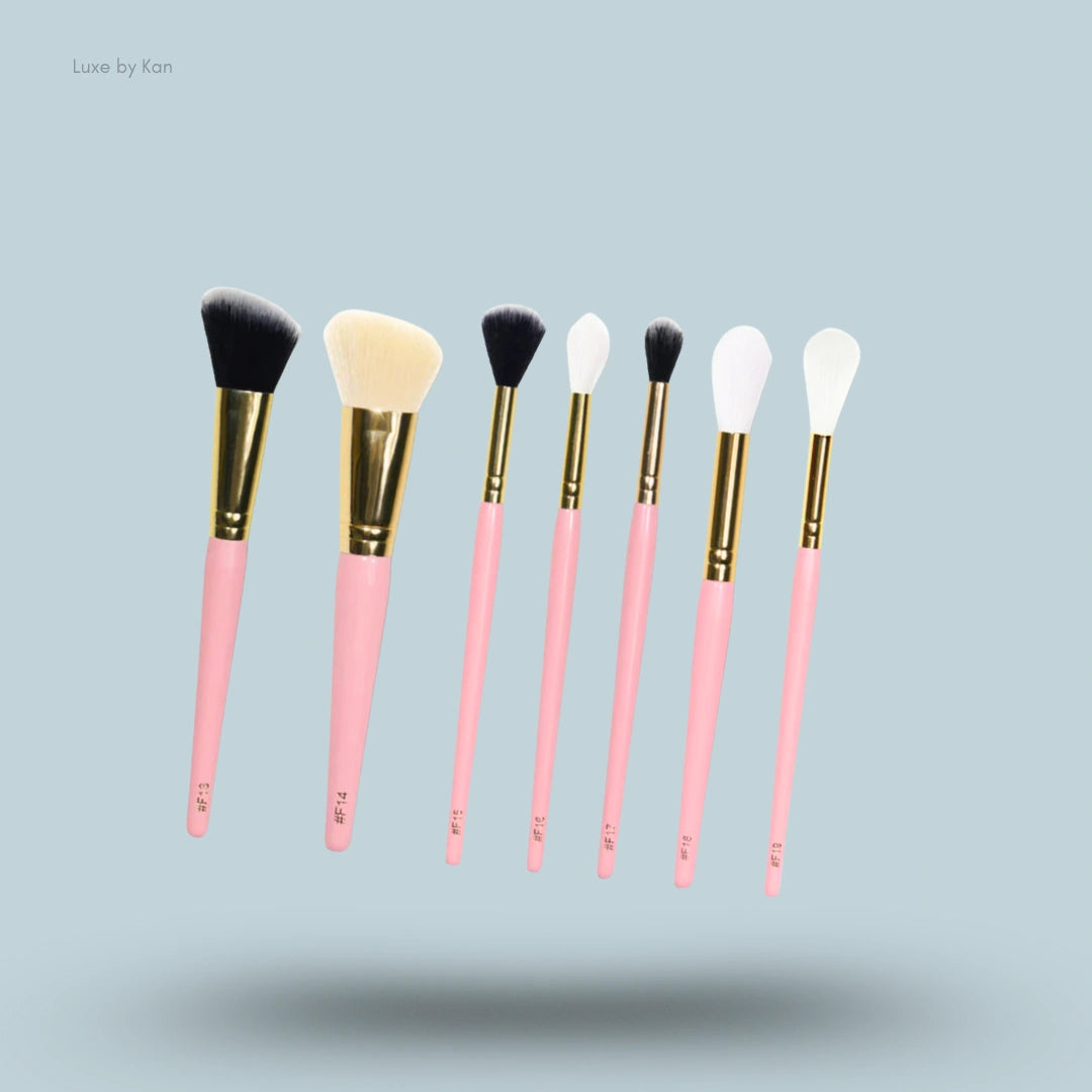 Seven Plouise Precise With My Destiny makeup brushes with pink handles and gold ferrules.