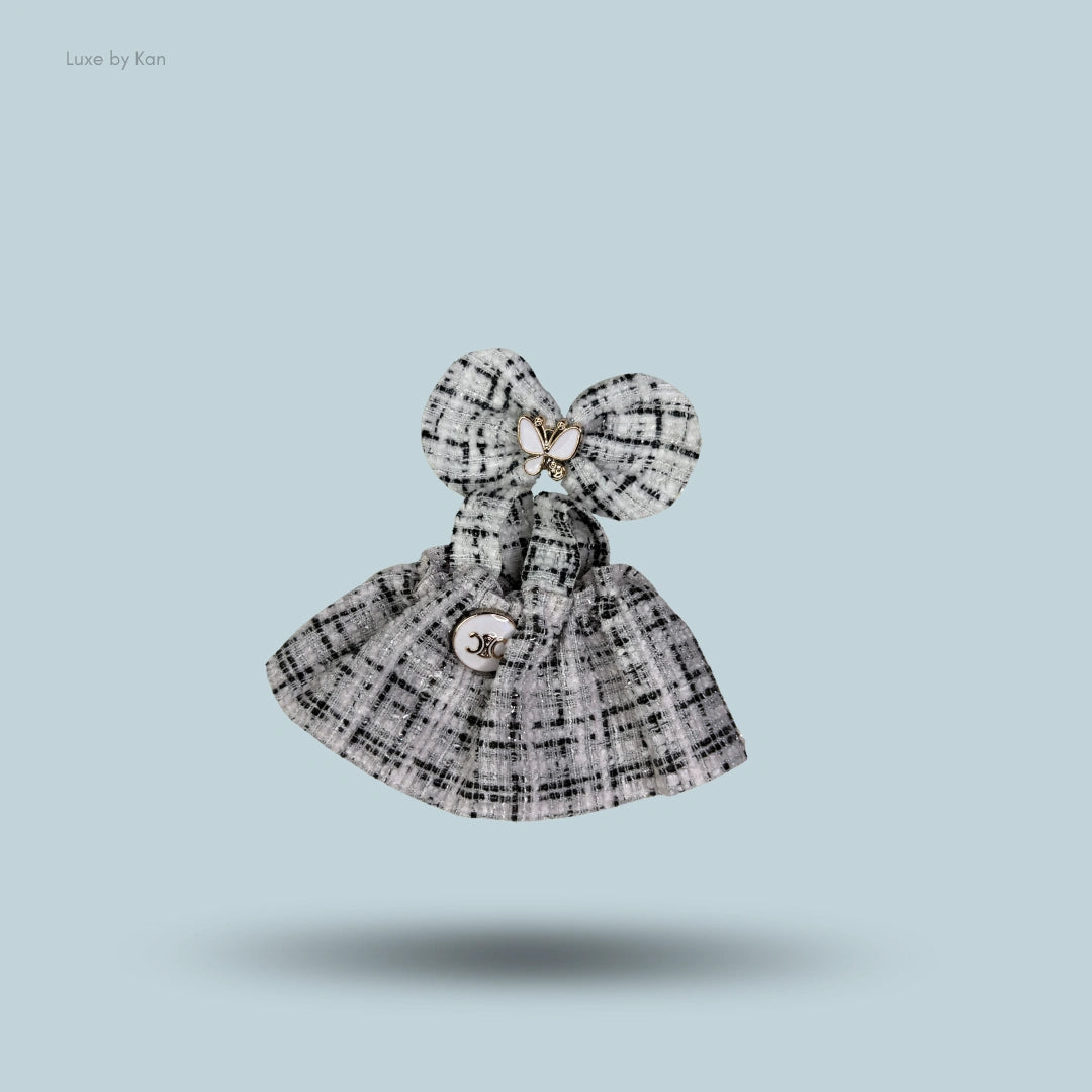 Tweed dress outfit with bow for the Pop Mart Labubu doll. The fabric is black and white tweed.