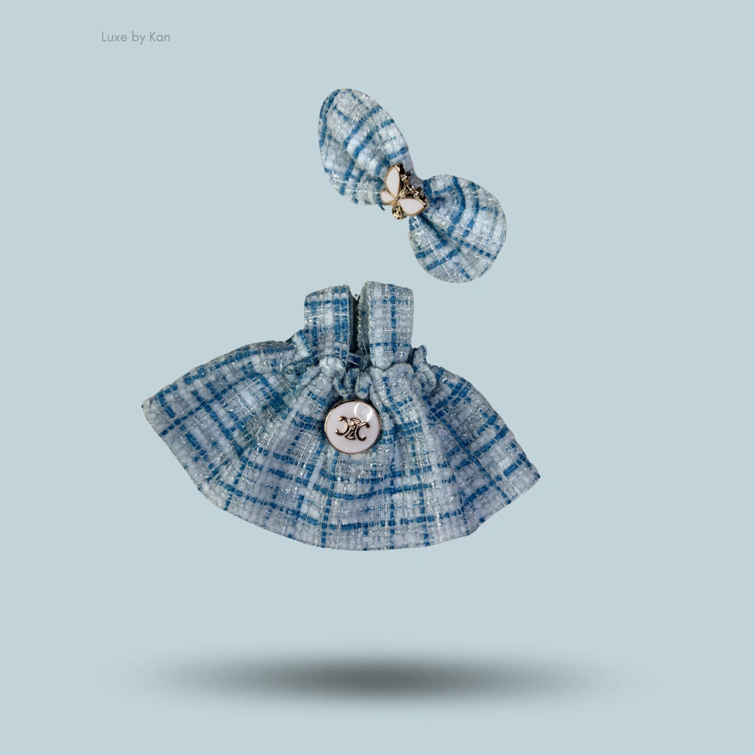 Labubu doll outfit: blue tweed dress with decorative button and matching bow.