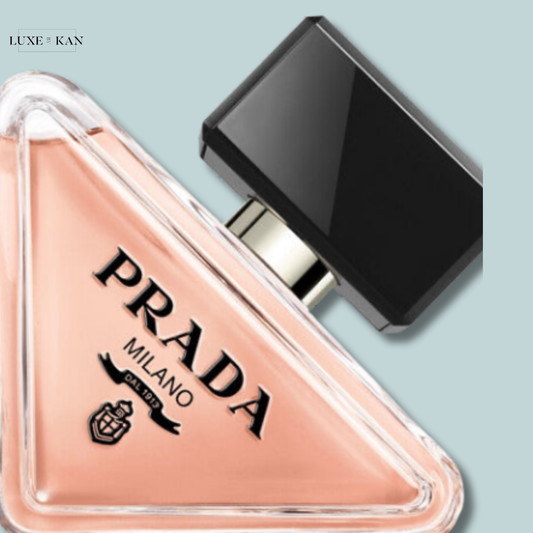 Prada Milano perfume bottle featuring a triangular design with a black cap.