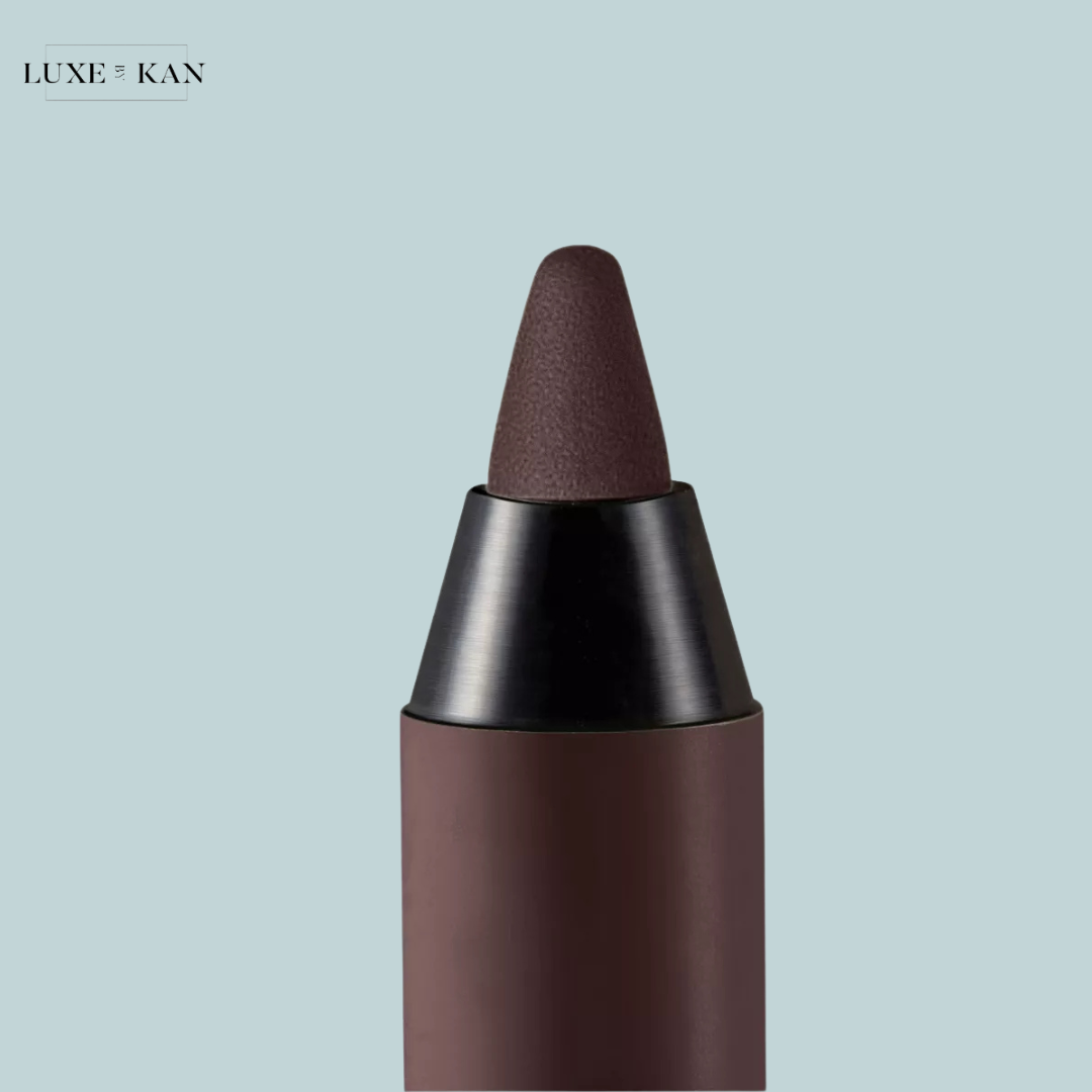 Close-up of a prada brow pradalines eyeliner pencil with a pointed tip.