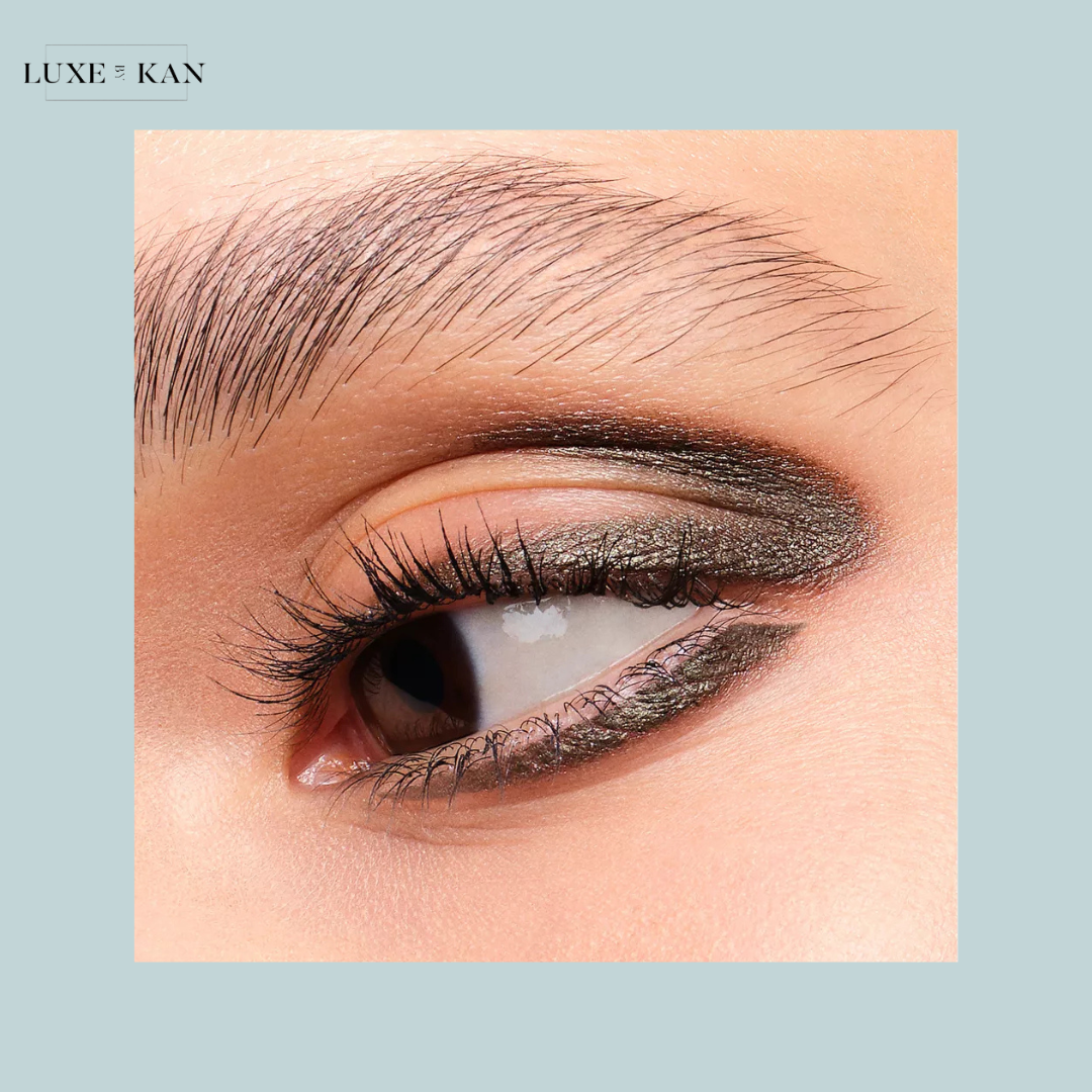 Close-up of a woman's eye with bold, prada pradalines eyeliner.