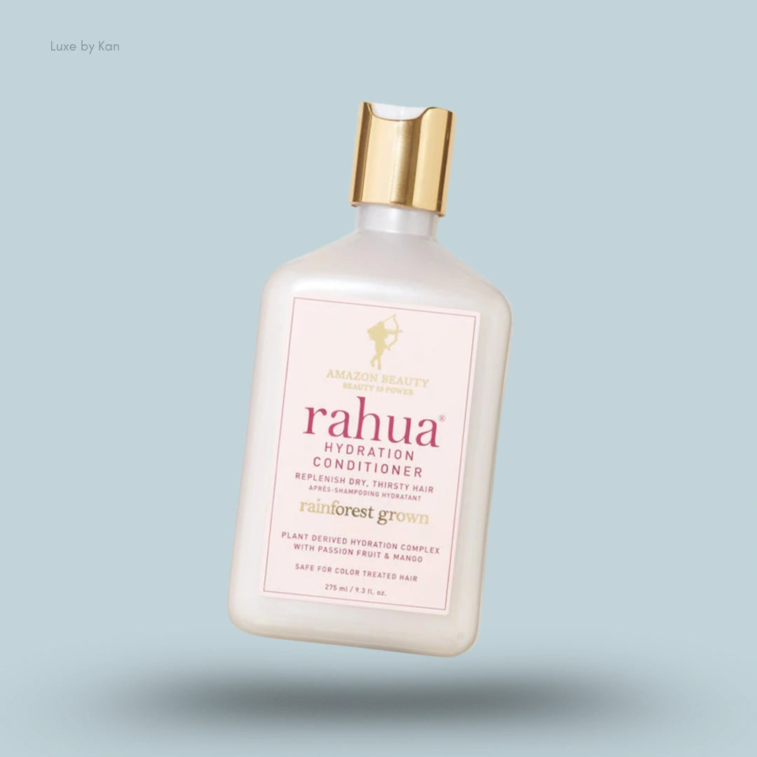 Rahua Hydration Conditioner bottle with a gold cap, featuring product information on a pink label.