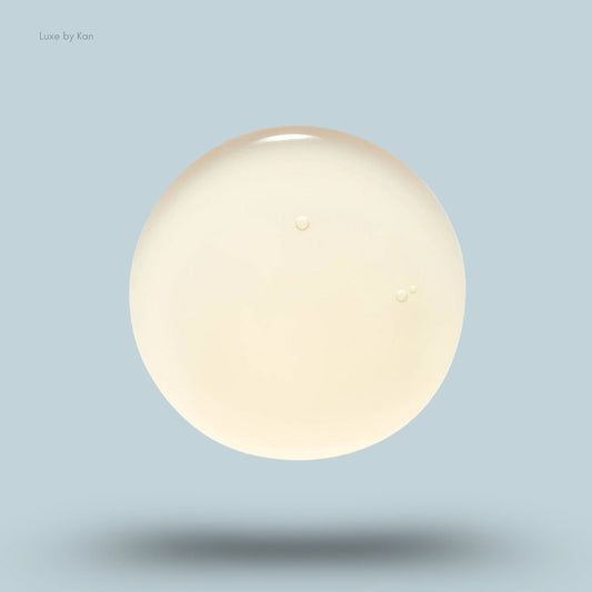 Close-up of a translucent, light yellow globule of Ranavat regenerative veda bond repair shampoo.