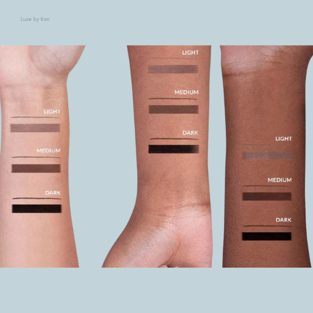 Swatches of makeup shades on three diverse skin tones labeled as Light, Medium, and Dark for guidance on color matching.