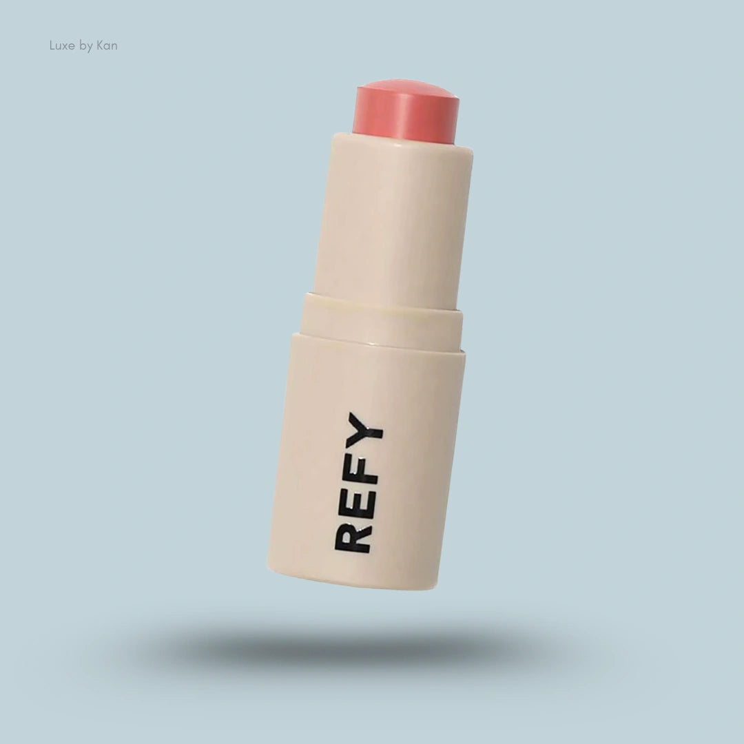 Refy Lip Blush container: beige base with the words "REFY" in dark block letters and a coral-colored top.