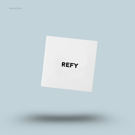 Square white Refy skin finish powder compact.