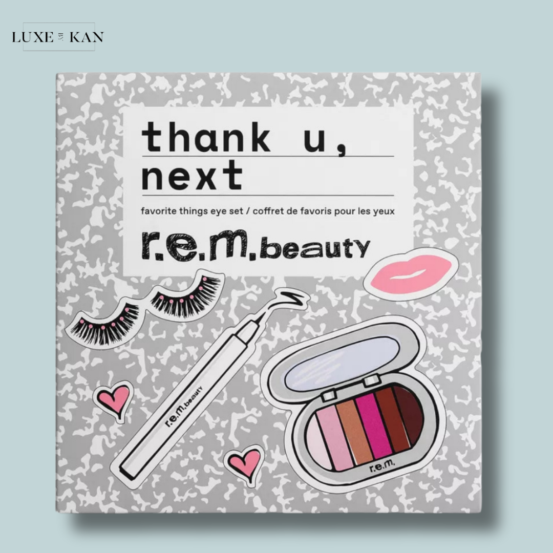 A gray box labeled "thank u, next favourite things eye set" with r.e.m. beauty branding, featuring eye products and playful doodles like eyelashes and hearts.