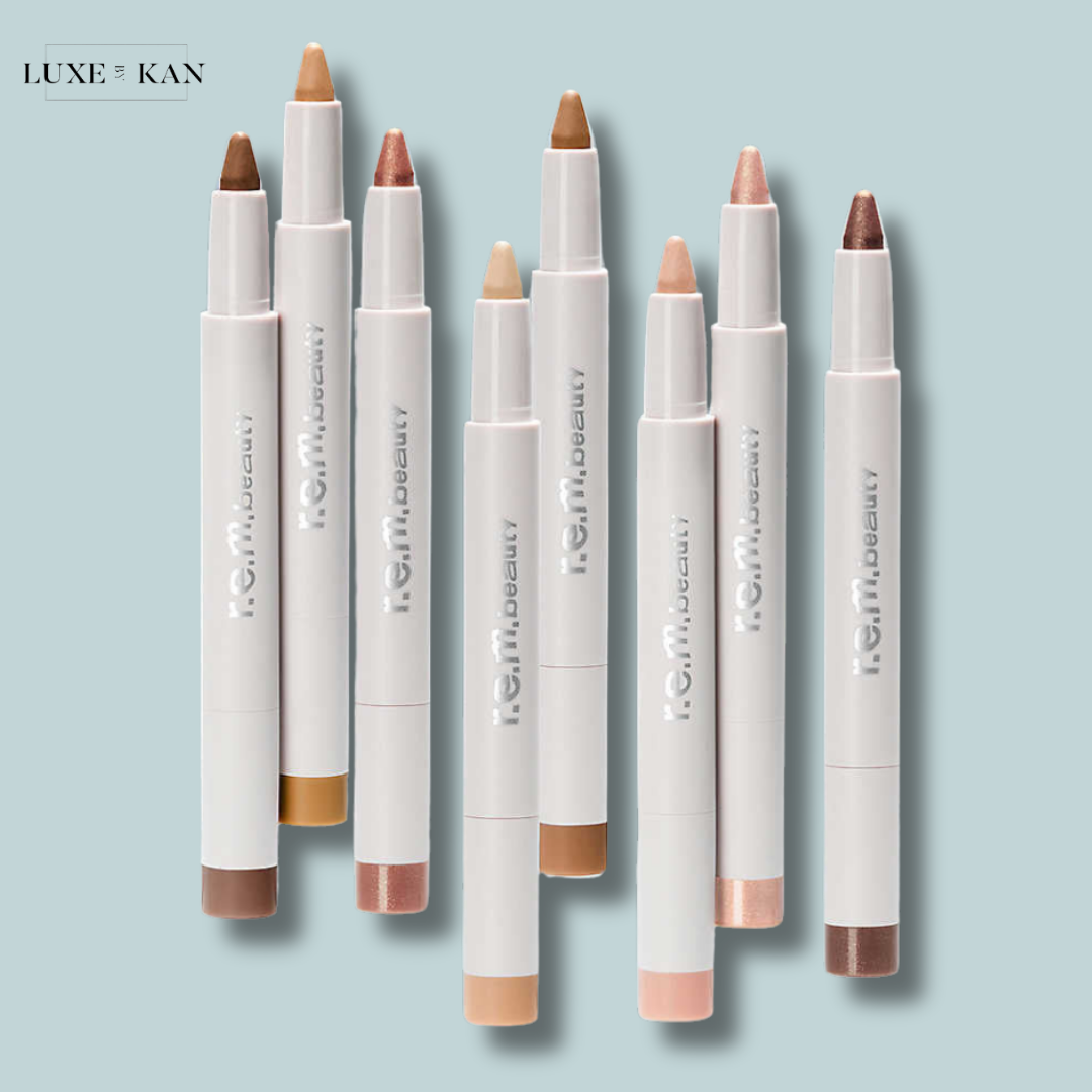 A collection of nine rem beauty eye stick in various skin tones.