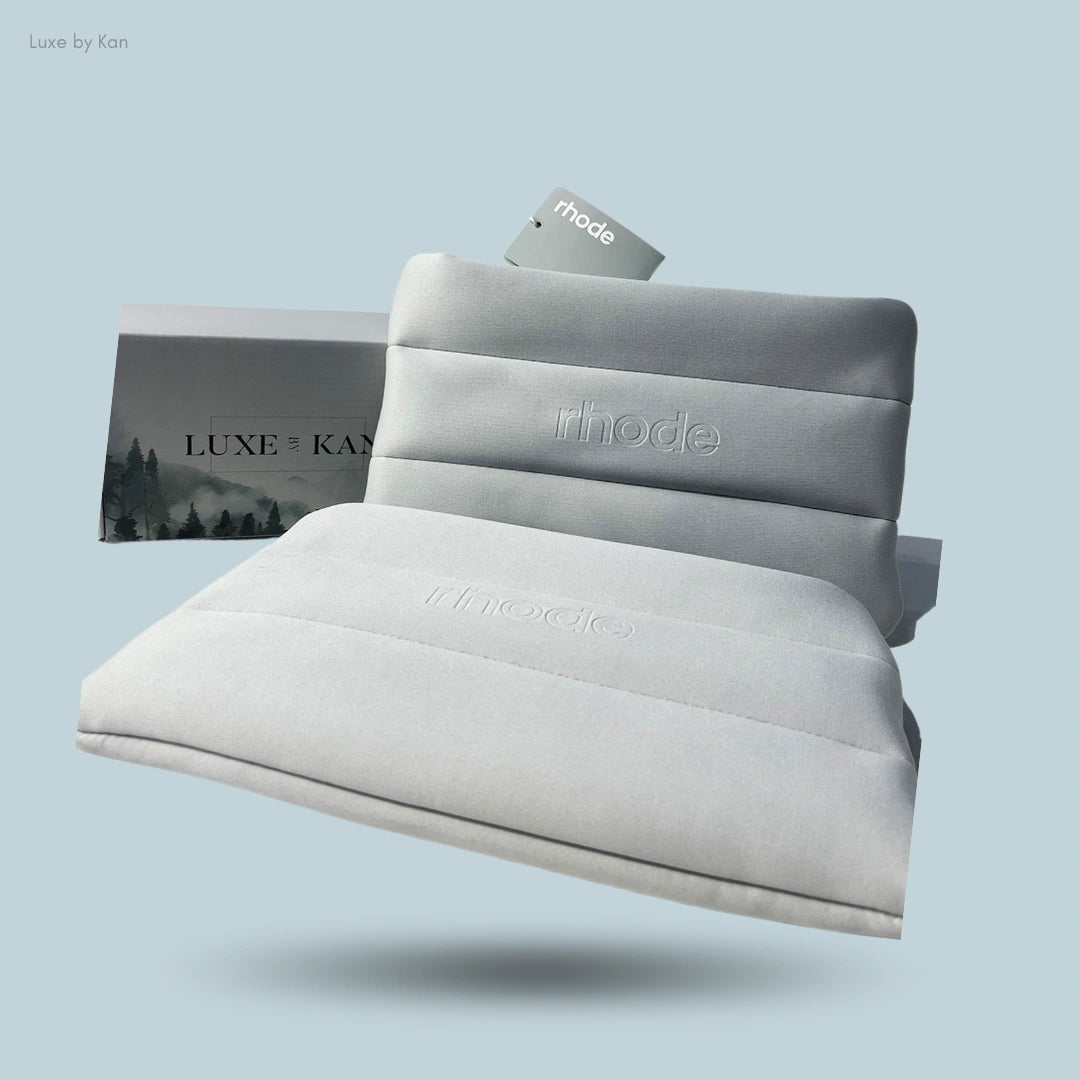 Light gray bubble cosmetic bag with "Rhode" debossed, displayed in front of a "Luxe by Kan" box.