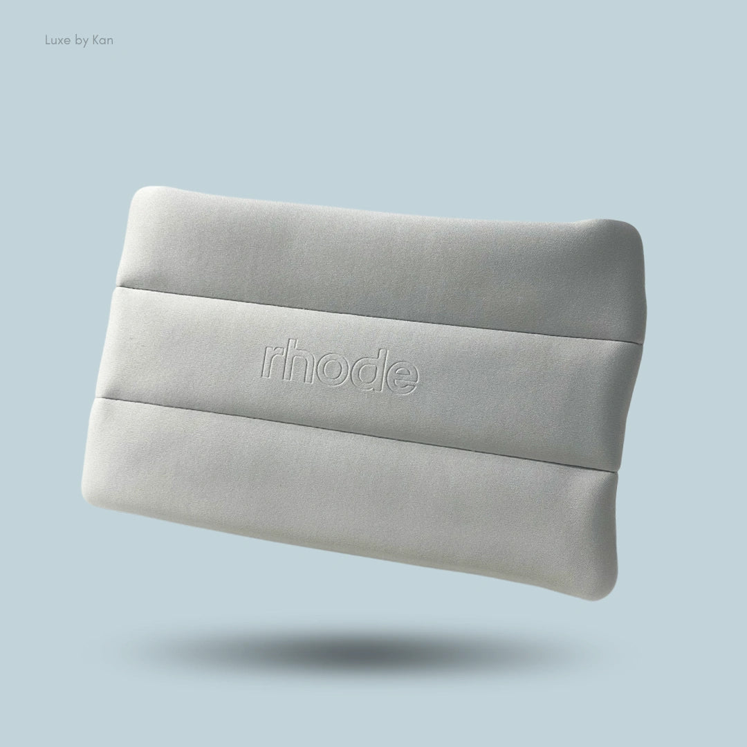 Rhode bubble makeup organizer pouch. Light gray rectangular pouch with horizontal padded design and embossed logo.