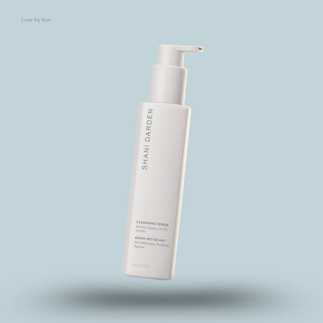 A square white bottle of Shani Darden Skincare Cleansing Serum with a pump.