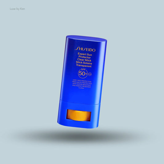Shiseido Expert Sun Protector Clear Stick SPF50+ in a blue container with orange twist-up base.