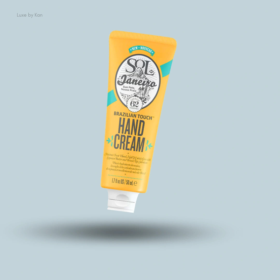 Sol de Janeiro Brazilian Touch Hand Cream in a yellow 50ml tube with teal accents against a light blue background.