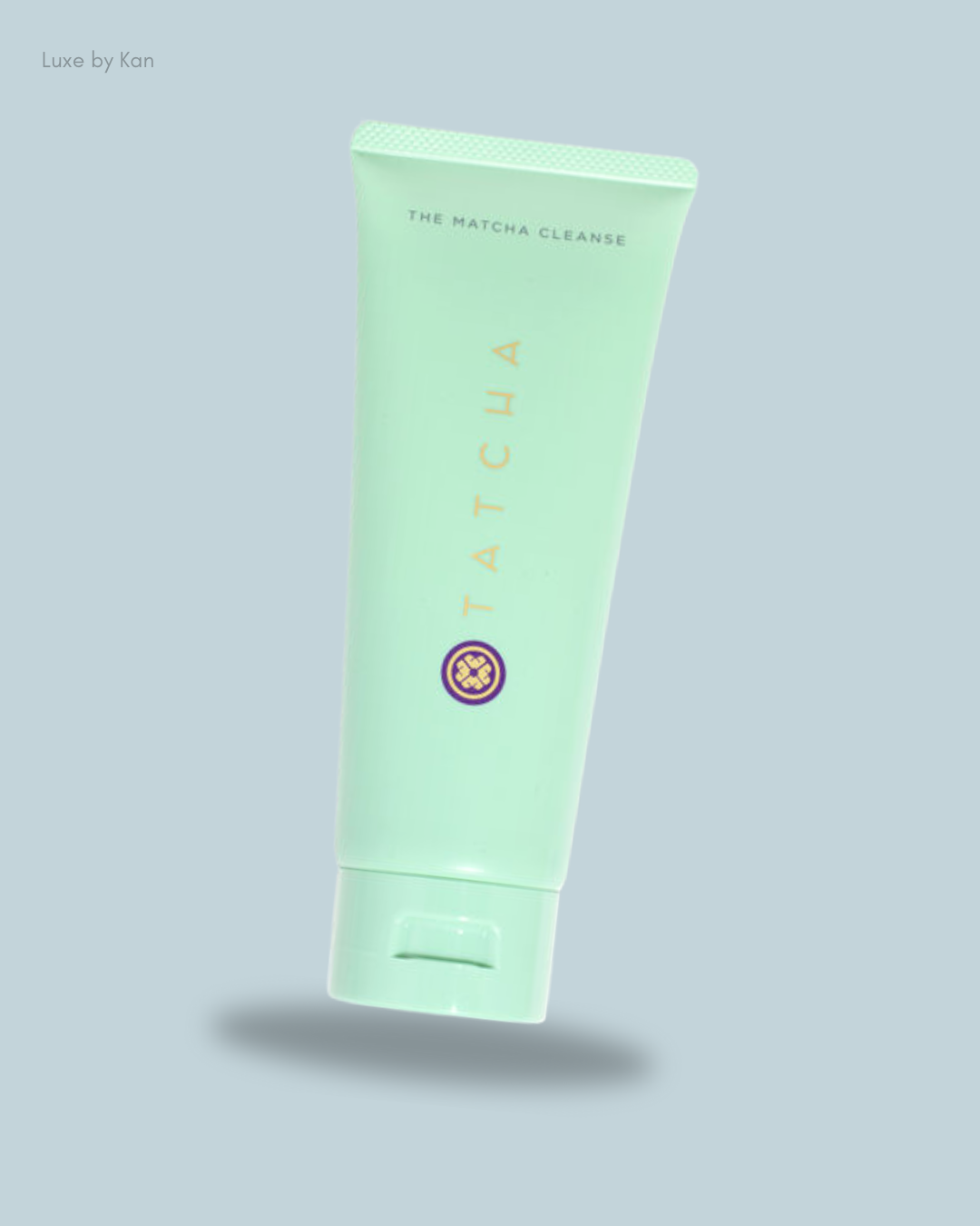 A mint green tube of Tatcha's The Matcha Cleanse facial cleanser with a gold logo.