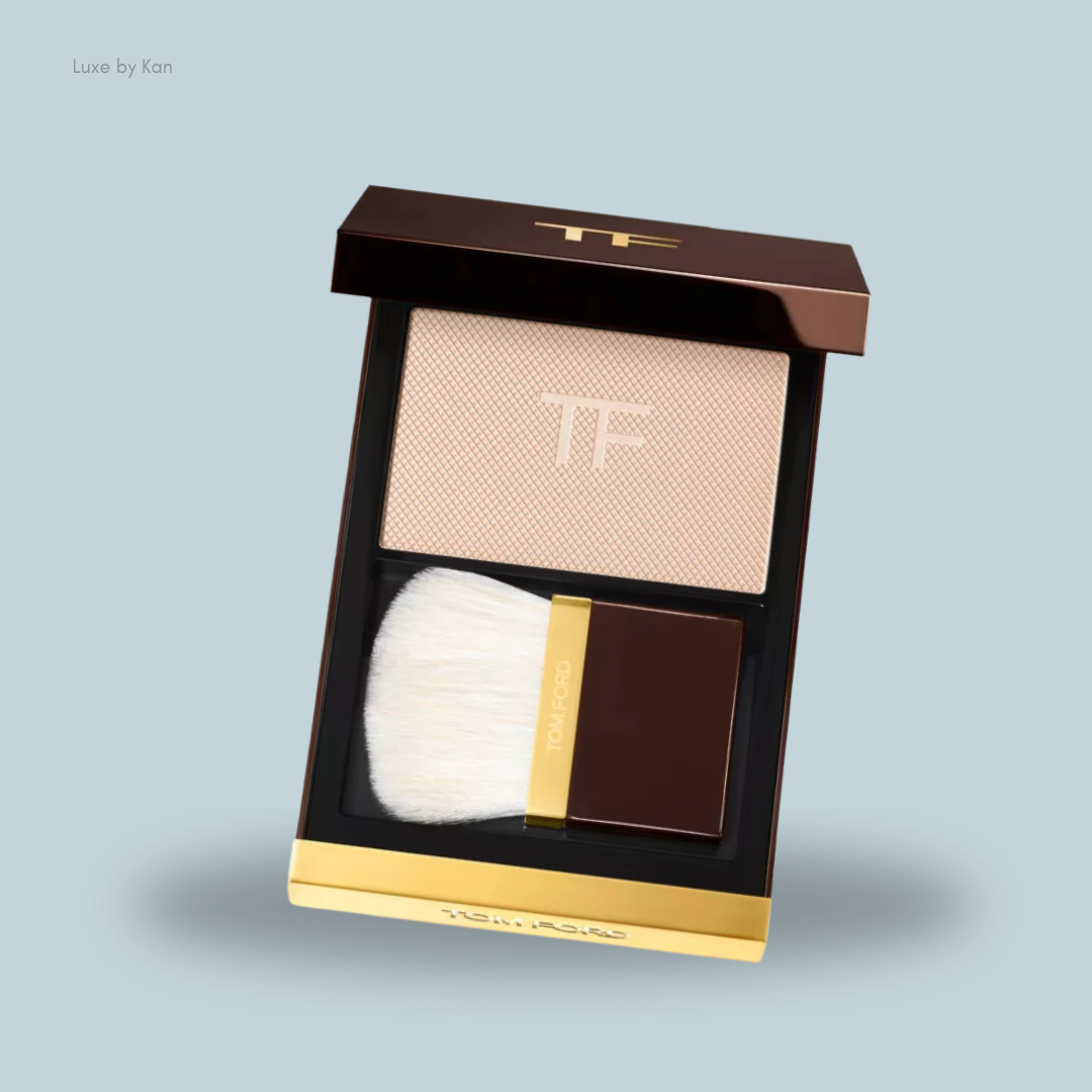 Tom Ford Architect Soft Matte Blurring Face Powder Compact, featuring a light peach powder, a soft brush, and an elegant brown and gold case.
