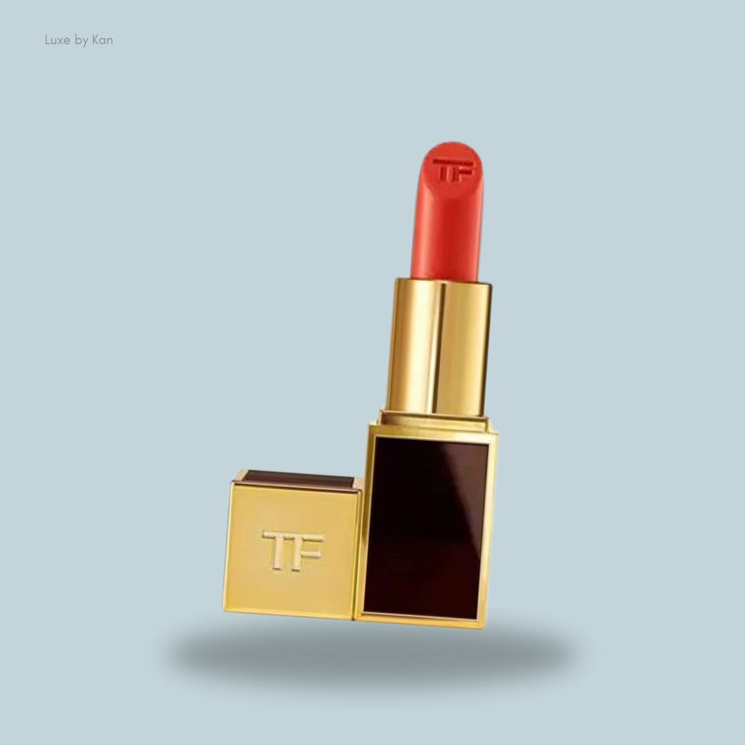 A luxurious Tom Ford Lip Color Lipstick in shade 71 Roberto, featuring a vibrant red bullet and the initials "TF" embossed on the cap and lipstick tip.