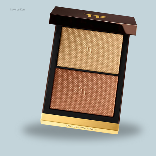 Tom Ford makeup palette featuring two textured bronzer shades: a warm gold and a rich bronze, set in a sleek case.