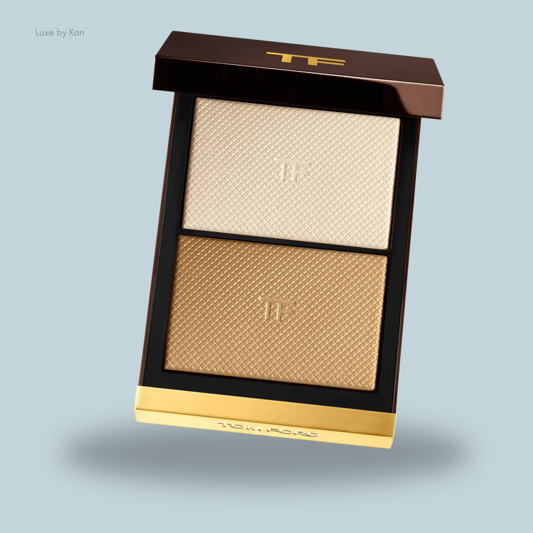 Tom Ford makeup palette featuring two textured shades: a light cream and a warm gold, elegantly packaged with a sleek design.