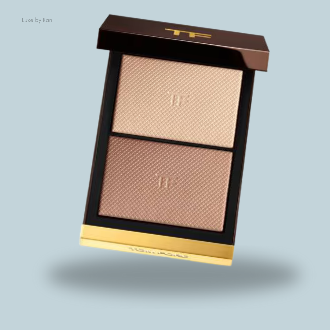 A luxurious makeup palette featuring two textured shades of highlighter in a sleek Tom Ford design.