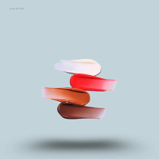 Fenty Skin Lil Puddin’ Pots Lip Mask Set – Cacao, Cranberry Glaze, Peppermint Sugar and Maple Cookies swatches on blue background