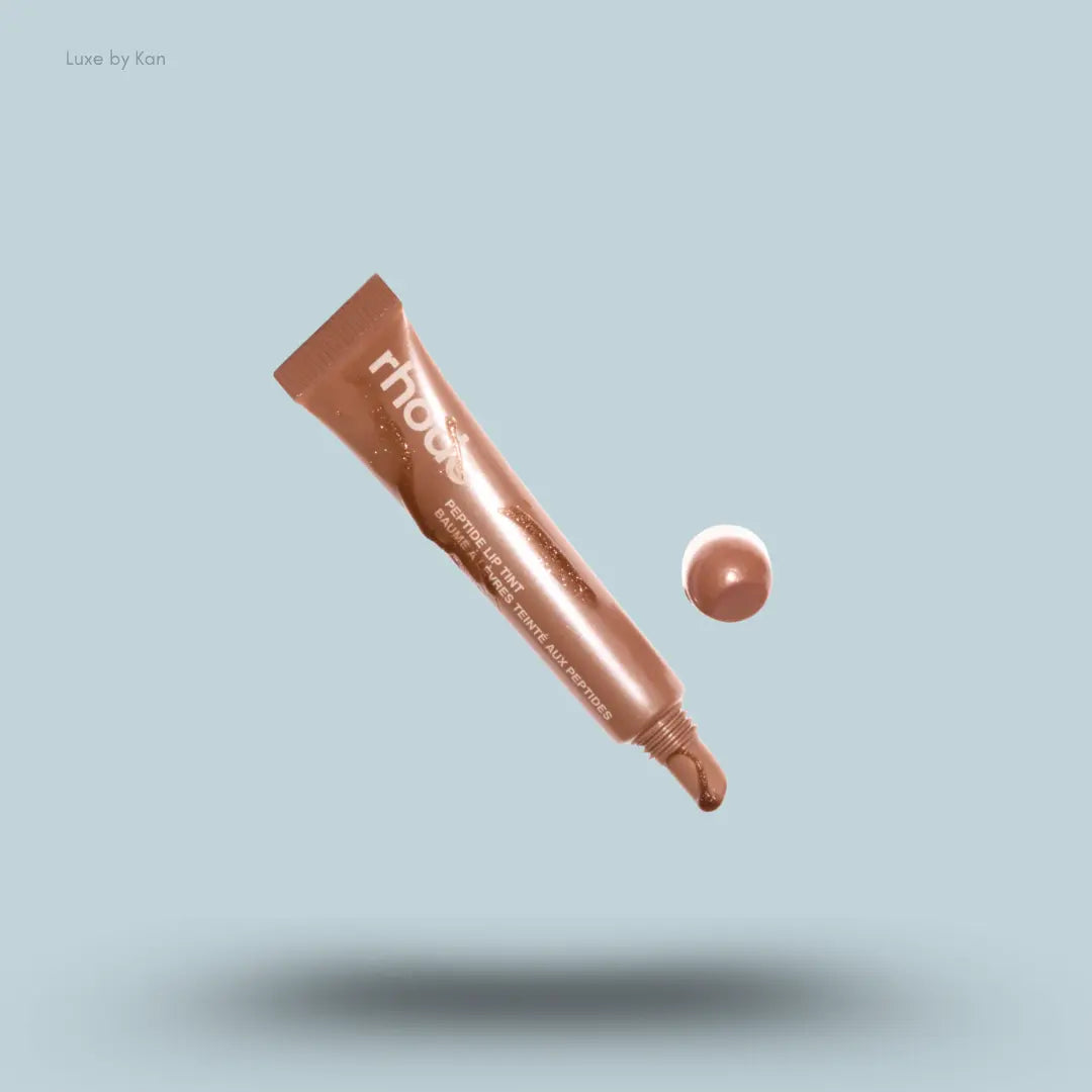 Rhode Peptide Lip Tint in Sweet Apple, shimmery golden brown tinted lip gloss tube