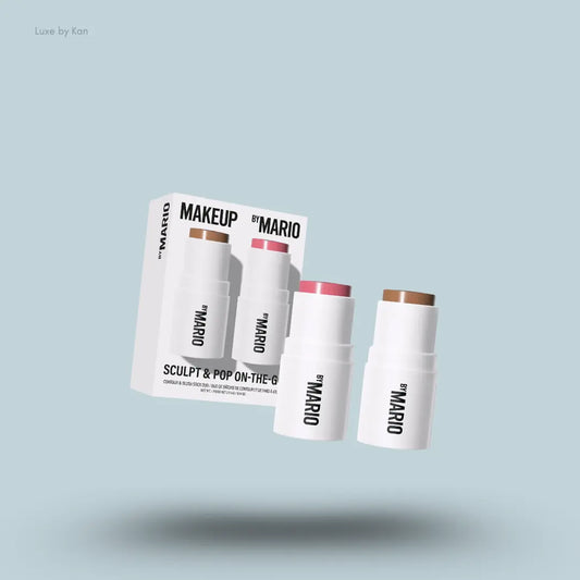 Makeup By Mario Sculpt & Pop On The Go Duo shaping stick and blush stick with packaging on blue background